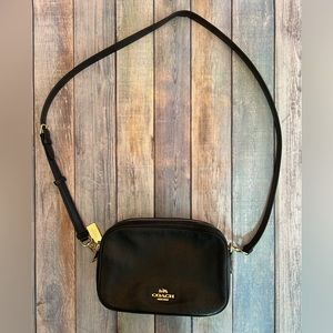 Coach black pebble leather women’s crossbody bag.